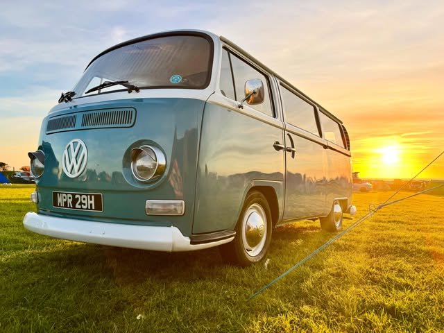 Edna the vintage VW camper wedding car photographed at sunset in a Lancashire field